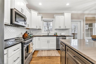 Discover the charm of this custom-built Craftsman home at Mt on Mountain Aire Golf Course in North Carolina - for sale on GolfHomes.com, golf home, golf lot