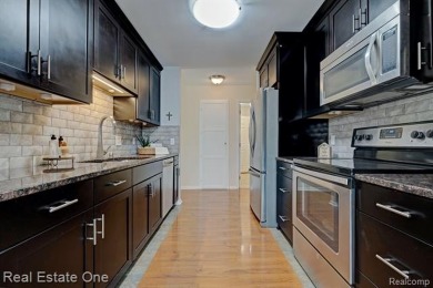 Beautiful End Unit Ranch Condo in Desirable Golf Community! on The Captains Club At Woodfield in Michigan - for sale on GolfHomes.com, golf home, golf lot