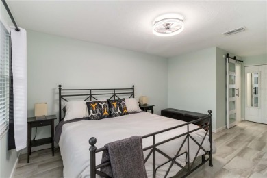 Enjoy peaceful unobstructed views of the lake and golf course on Palm Aire Country Club of Sarasota in Florida - for sale on GolfHomes.com, golf home, golf lot