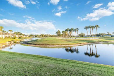 Enjoy peaceful unobstructed views of the lake and golf course on Palm Aire Country Club of Sarasota in Florida - for sale on GolfHomes.com, golf home, golf lot