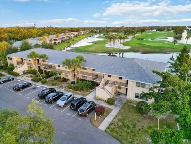 Enjoy peaceful unobstructed views of the lake and golf course on Palm Aire Country Club of Sarasota in Florida - for sale on GolfHomes.com, golf home, golf lot