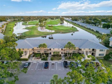 Enjoy peaceful unobstructed views of the lake and golf course on Palm Aire Country Club of Sarasota in Florida - for sale on GolfHomes.com, golf home, golf lot