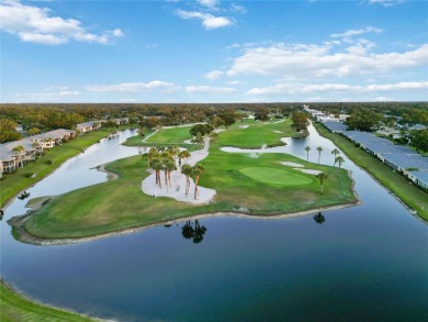 Enjoy peaceful unobstructed views of the lake and golf course on Palm Aire Country Club of Sarasota in Florida - for sale on GolfHomes.com, golf home, golf lot