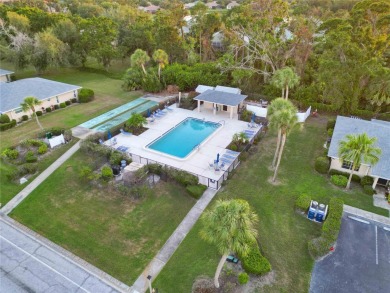 Enjoy peaceful unobstructed views of the lake and golf course on Palm Aire Country Club of Sarasota in Florida - for sale on GolfHomes.com, golf home, golf lot