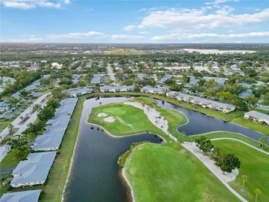 Enjoy peaceful unobstructed views of the lake and golf course on Palm Aire Country Club of Sarasota in Florida - for sale on GolfHomes.com, golf home, golf lot