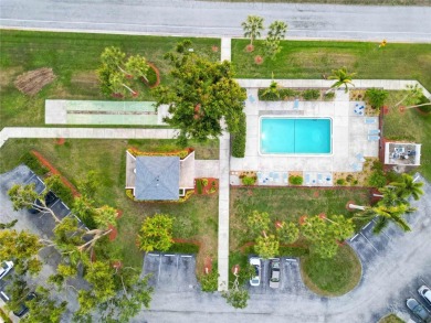 Enjoy peaceful unobstructed views of the lake and golf course on Palm Aire Country Club of Sarasota in Florida - for sale on GolfHomes.com, golf home, golf lot