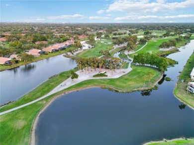 Enjoy peaceful unobstructed views of the lake and golf course on Palm Aire Country Club of Sarasota in Florida - for sale on GolfHomes.com, golf home, golf lot