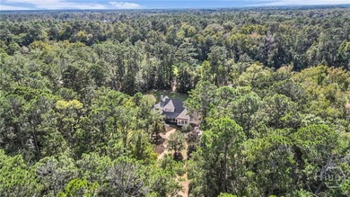 Tucked within this exclusive community, this 4-bed, 4-full & on The Ford Field and River Club  in Georgia - for sale on GolfHomes.com, golf home, golf lot