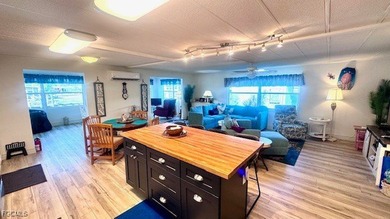 Beautiful WATERFRONT 2BR/2BA home in the desirable 55+ community on Riverbend Golf and Country Club in Florida - for sale on GolfHomes.com, golf home, golf lot