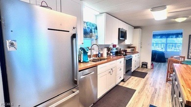 Beautiful WATERFRONT 2BR/2BA home in the desirable 55+ community on Riverbend Golf and Country Club in Florida - for sale on GolfHomes.com, golf home, golf lot