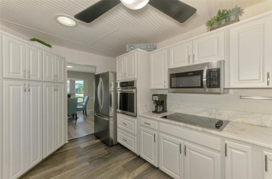 MUST SEE!  SPLIT BEDROOM PLAN!  DOUBLE LOT!  UPDATED!  HEATED on Oyster Creek Golf Club in Florida - for sale on GolfHomes.com, golf home, golf lot