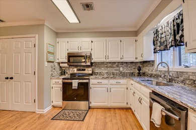 Welcome to a villa that feels less like a ''unit'' and more like on Houndslake Country Club in South Carolina - for sale on GolfHomes.com, golf home, golf lot