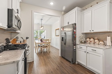 This move-in-ready home features luxury vinyl plank flooring on Shaftesbury Glen Golf and Fish Club in South Carolina - for sale on GolfHomes.com, golf home, golf lot