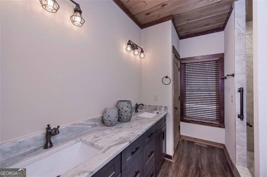 Nestled in the serene beauty of the North Georgia mountains on White Path Golf Club in Georgia - for sale on GolfHomes.com, golf home, golf lot