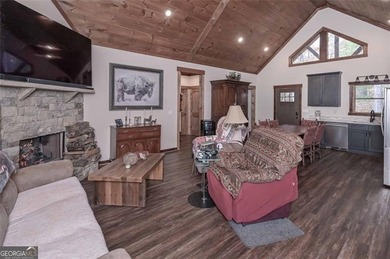 Nestled in the serene beauty of the North Georgia mountains on White Path Golf Club in Georgia - for sale on GolfHomes.com, golf home, golf lot