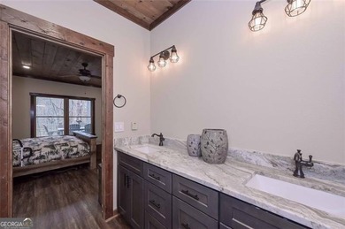 Nestled in the serene beauty of the North Georgia mountains on White Path Golf Club in Georgia - for sale on GolfHomes.com, golf home, golf lot