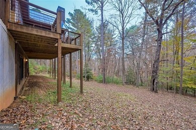 Nestled in the serene beauty of the North Georgia mountains on White Path Golf Club in Georgia - for sale on GolfHomes.com, golf home, golf lot