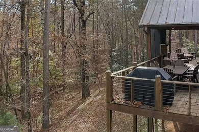 Nestled in the serene beauty of the North Georgia mountains on White Path Golf Club in Georgia - for sale on GolfHomes.com, golf home, golf lot