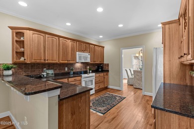 Welcome to 305 Tall Ships Lane-an impeccably maintained brick on Belvedere Country Club in North Carolina - for sale on GolfHomes.com, golf home, golf lot