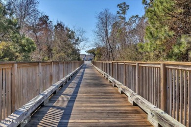 Experience coastal living in this meticulously maintained on South Harbour Golf Links in North Carolina - for sale on GolfHomes.com, golf home, golf lot