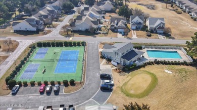 Experience coastal living in this meticulously maintained on South Harbour Golf Links in North Carolina - for sale on GolfHomes.com, golf home, golf lot