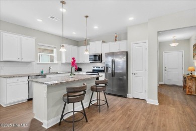 Discover exceptional living at 195 Hawks Run Drive in Eagle Run on Crow Creek Golf Club in North Carolina - for sale on GolfHomes.com, golf home, golf lot