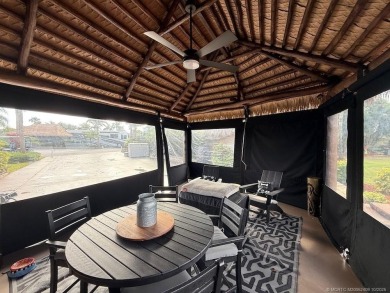 This beautifully landscaped tiki lot offers breathtaking sunset on Motorcoach Resort Golf Course in Florida - for sale on GolfHomes.com, golf home, golf lot