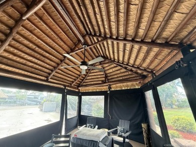 This beautifully landscaped tiki lot offers breathtaking sunset on Motorcoach Resort Golf Course in Florida - for sale on GolfHomes.com, golf home, golf lot