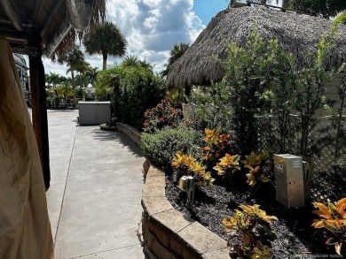 This beautifully landscaped tiki lot offers breathtaking sunset on Motorcoach Resort Golf Course in Florida - for sale on GolfHomes.com, golf home, golf lot