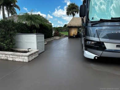 This beautifully landscaped tiki lot offers breathtaking sunset on Motorcoach Resort Golf Course in Florida - for sale on GolfHomes.com, golf home, golf lot