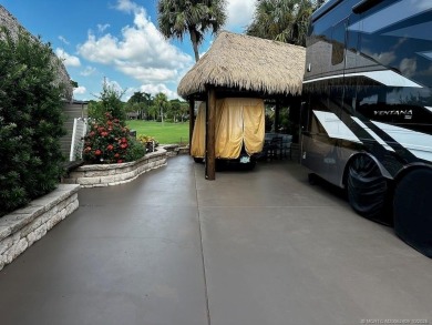 This beautifully landscaped tiki lot offers breathtaking sunset on Motorcoach Resort Golf Course in Florida - for sale on GolfHomes.com, golf home, golf lot