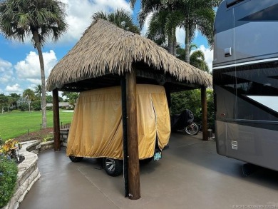 This beautifully landscaped tiki lot offers breathtaking sunset on Motorcoach Resort Golf Course in Florida - for sale on GolfHomes.com, golf home, golf lot