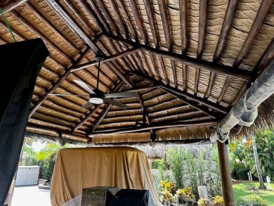 This beautifully landscaped tiki lot offers breathtaking sunset on Motorcoach Resort Golf Course in Florida - for sale on GolfHomes.com, golf home, golf lot