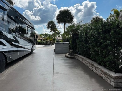 This beautifully landscaped tiki lot offers breathtaking sunset on Motorcoach Resort Golf Course in Florida - for sale on GolfHomes.com, golf home, golf lot