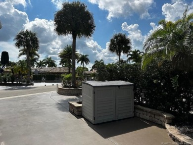 This beautifully landscaped tiki lot offers breathtaking sunset on Motorcoach Resort Golf Course in Florida - for sale on GolfHomes.com, golf home, golf lot