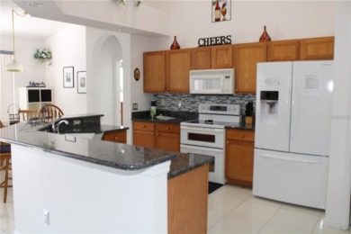 This beautiful home features 4 bedrooms and 3 bathrooms, plus a on Highlands Reserve Golf Club in Florida - for sale on GolfHomes.com, golf home, golf lot
