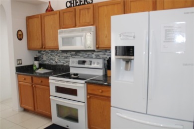 This beautiful home features 4 bedrooms and 3 bathrooms, plus a on Highlands Reserve Golf Club in Florida - for sale on GolfHomes.com, golf home, golf lot