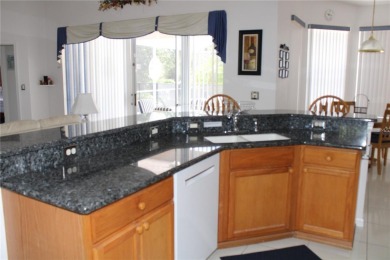 This beautiful home features 4 bedrooms and 3 bathrooms, plus a on Highlands Reserve Golf Club in Florida - for sale on GolfHomes.com, golf home, golf lot