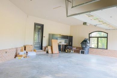 This stunning all-brick home, has been completely remodeled to on RidgePointe Country Club in Arkansas - for sale on GolfHomes.com, golf home, golf lot