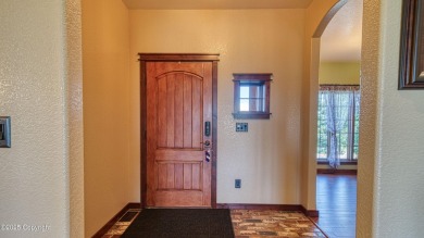 Welcome to this charming custom home on 1.11 acres with on Bell Nob Golf Course in Wyoming - for sale on GolfHomes.com, golf home, golf lot