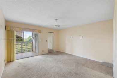 SPACIOUS 2 BED / 2 BATH LOCATED IN DESIRABLE COMMUNITY WITH on Wynmoor Golf Course in Florida - for sale on GolfHomes.com, golf home, golf lot