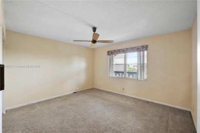 SPACIOUS 2 BED / 2 BATH LOCATED IN DESIRABLE COMMUNITY WITH on Wynmoor Golf Course in Florida - for sale on GolfHomes.com, golf home, golf lot