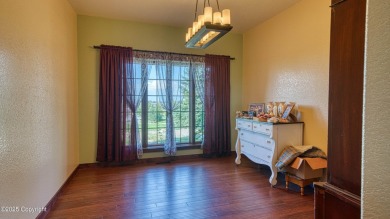 Welcome to this charming custom home on 1.11 acres with on Bell Nob Golf Course in Wyoming - for sale on GolfHomes.com, golf home, golf lot
