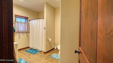Welcome to this charming custom home on 1.11 acres with on Bell Nob Golf Course in Wyoming - for sale on GolfHomes.com, golf home, golf lot