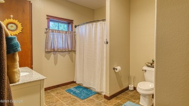 Welcome to this charming custom home on 1.11 acres with on Bell Nob Golf Course in Wyoming - for sale on GolfHomes.com, golf home, golf lot