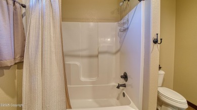 Welcome to this charming custom home on 1.11 acres with on Bell Nob Golf Course in Wyoming - for sale on GolfHomes.com, golf home, golf lot