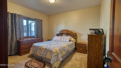 Welcome to this charming custom home on 1.11 acres with on Bell Nob Golf Course in Wyoming - for sale on GolfHomes.com, golf home, golf lot