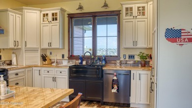 Welcome to this charming custom home on 1.11 acres with on Bell Nob Golf Course in Wyoming - for sale on GolfHomes.com, golf home, golf lot