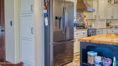 Welcome to this charming custom home on 1.11 acres with on Bell Nob Golf Course in Wyoming - for sale on GolfHomes.com, golf home, golf lot