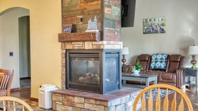 Welcome to this charming custom home on 1.11 acres with on Bell Nob Golf Course in Wyoming - for sale on GolfHomes.com, golf home, golf lot